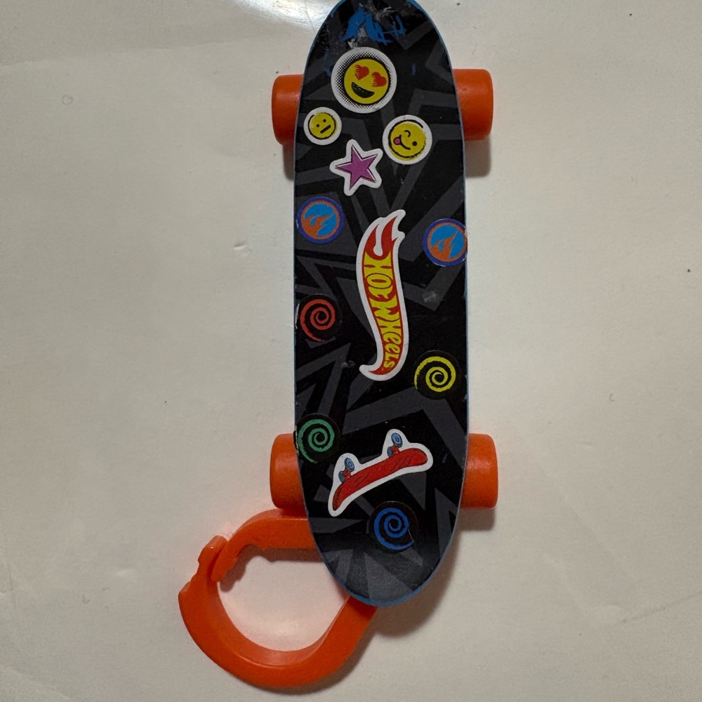A collectible McDonald's Hot Wheels Finger Board skateboard Keychain